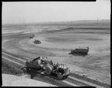 Earth movers leveling site for placement of Above-ground Storage Tank