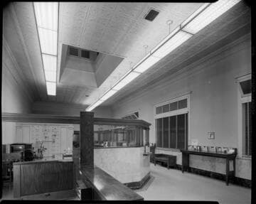 Bank interior, showing safe behind counter