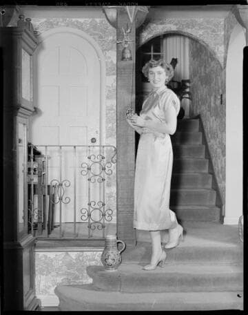 Woman at home posing around house