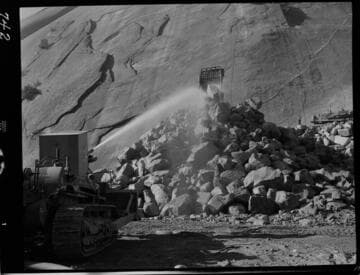 Big Creek - Mammoth Pool - Rock toe fill operation showing monitor unit mounted on TD-24 tractor