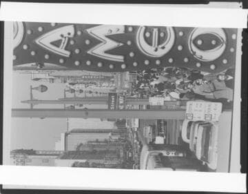 Crowd on a city street (near 5th Street and Coast Federal Savings building); and a dense crowd in an open field