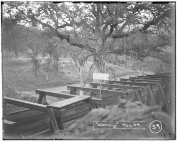 A warning sign that reads: "No trespassing on this ditch.  Keep off  CT Digger".  The sign is on a flume at Kaweah #2 Hydro Plant