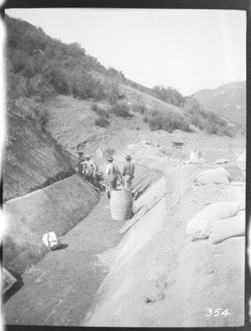 A construction crew plastering the ditch at the Tule Plant