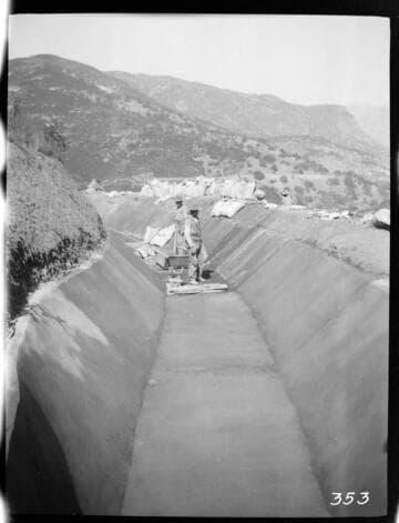 A construction crew plastering the ditch at the Tule Plant