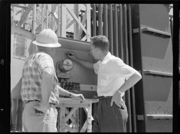 Men inspecting meter box at North East City Substation