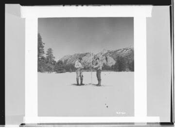 Snow survey, 2 men on snow shoes measureing snow pack with snow pole