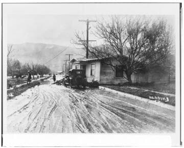 Aftermath of the St. Francis flood:  a home washed partly across Harvard Blvd. in Santa Paula