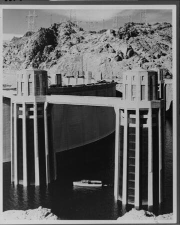 A sightseeing boat gives an idea of the grand scale of Hoover Dam