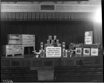 Display of commercial restaurant cooking equipment and food products on the stage the G.O. auditorium