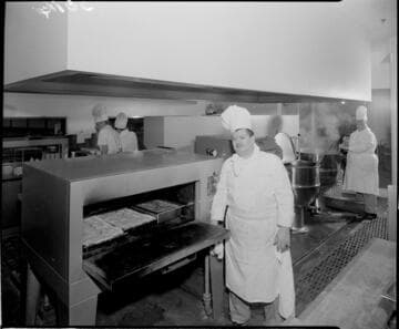 Chef with food in ovens