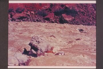 Dock Marston putting the "Joan" thru Hance Rapid.  Bright Angel gauge:  27,200 cfs