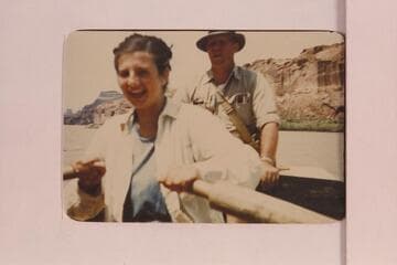 Dianne Mayes at oars.  Max Krueger in background