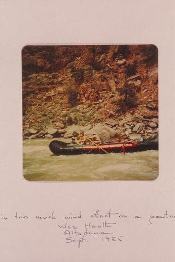 Hatch pontoon riding out lower end of Disaster Rapid.  Low water