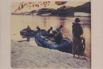 The Hatch inflated craft pushing off from camp on the left bank at Mile 55 or 53, left bank