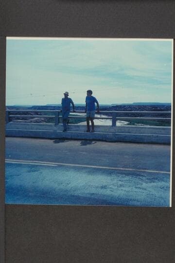 Nathan Marston and Jim Jordan on new highway bridge at Cameron.  Upstream on river flowing mud