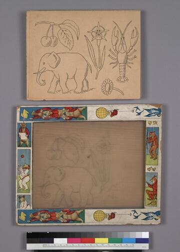 Glass drawing slate within a decorative wooden frame with paper border