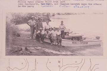 The Nevills party prior to departure from the beach above the D&RG trestle at Green River, Utah.Seated:Nevills, Reed, Anne Rosner;Goldwater; Doris Nevills.Millie Baker stands third from left.John Southworth,Larabee,Cutler, standing