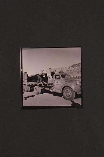 Unloading boats at Cliff Dweller's Lodge.  Rod Sanderson, Dick Rose, Vern ? and Bill Belknap move boat onto truck from the trailer