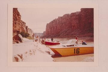 The two 24-ft. Thunderbirds at Mile 4.  The "Big Red" fouled rocks at Mile 3 1/2 and is being bailed.  After temporary repairs, the trip was abandoned and the boats run back to Lees Ferry