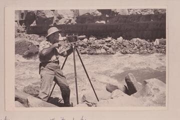 Al Morton.  Dark Canyon Rapid in Cataract Canyon.  Morton wears authority boots
