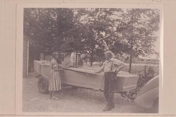 Margaret Marston and Bert Loper examine his boat at his Green River home