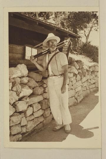 Dock Marston by the Kolb Studio and boat at Grand Canyon after the traverse of Grand Canyon with Nevills