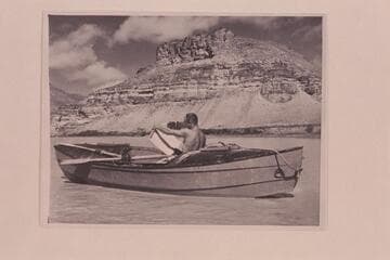Buzz Holmstrom studies the maps in his skiff just below Green River, Wyoming