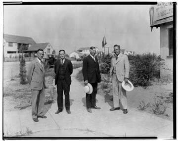 Four salesmen in front of subdivision sales office, East Mountain. Pasadena. 1928