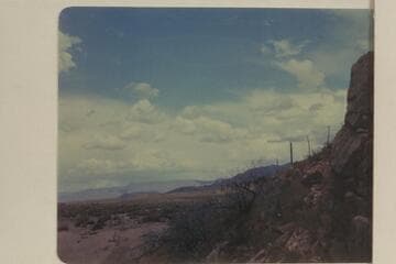 Valley at foot of Grand Wash Cliffs from the Highway 66. This open wash is a natural route to follow for a man such as James White who was escaping the San Juan country and staying out of sight