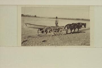 Portage of Freeman's steel boat at intake dam at Glendive