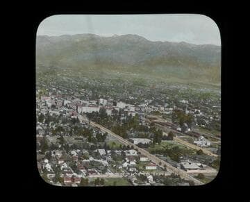 Aerial view of Pasadena looking north along Fair Oaks Avenue with Hotel Green and train tracks visible